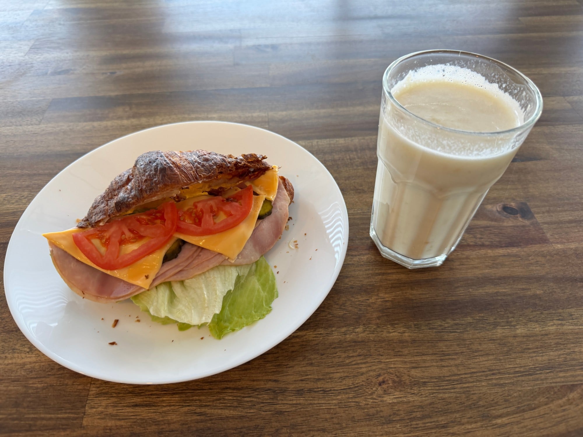Ham and cheese croissant with a smoothie