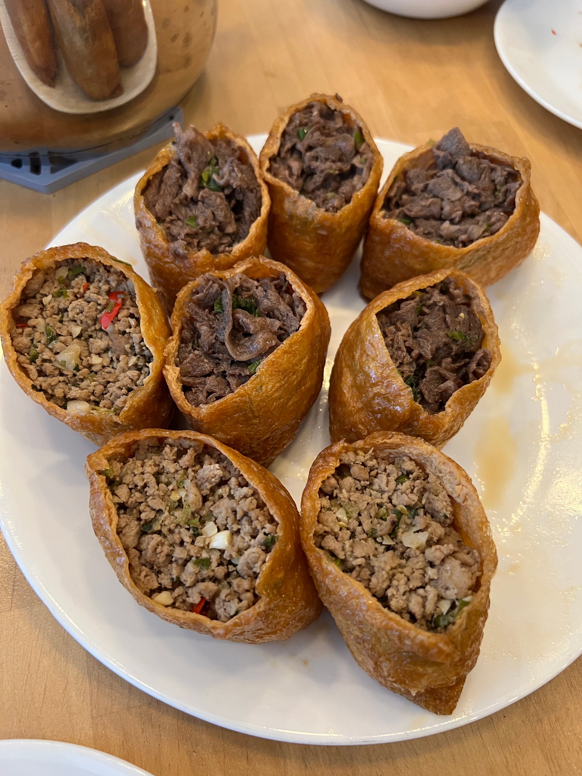 Tofu pockets filled with rice and seasoned beef