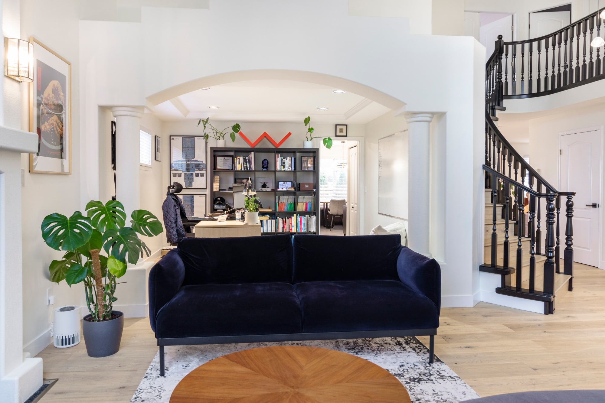 Bright main floor with a curved staircase