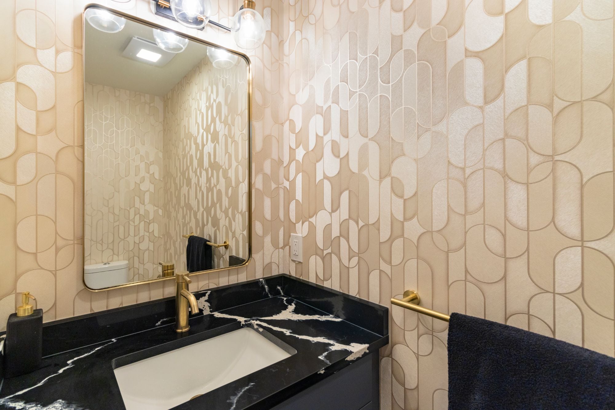Brass details in the powder room