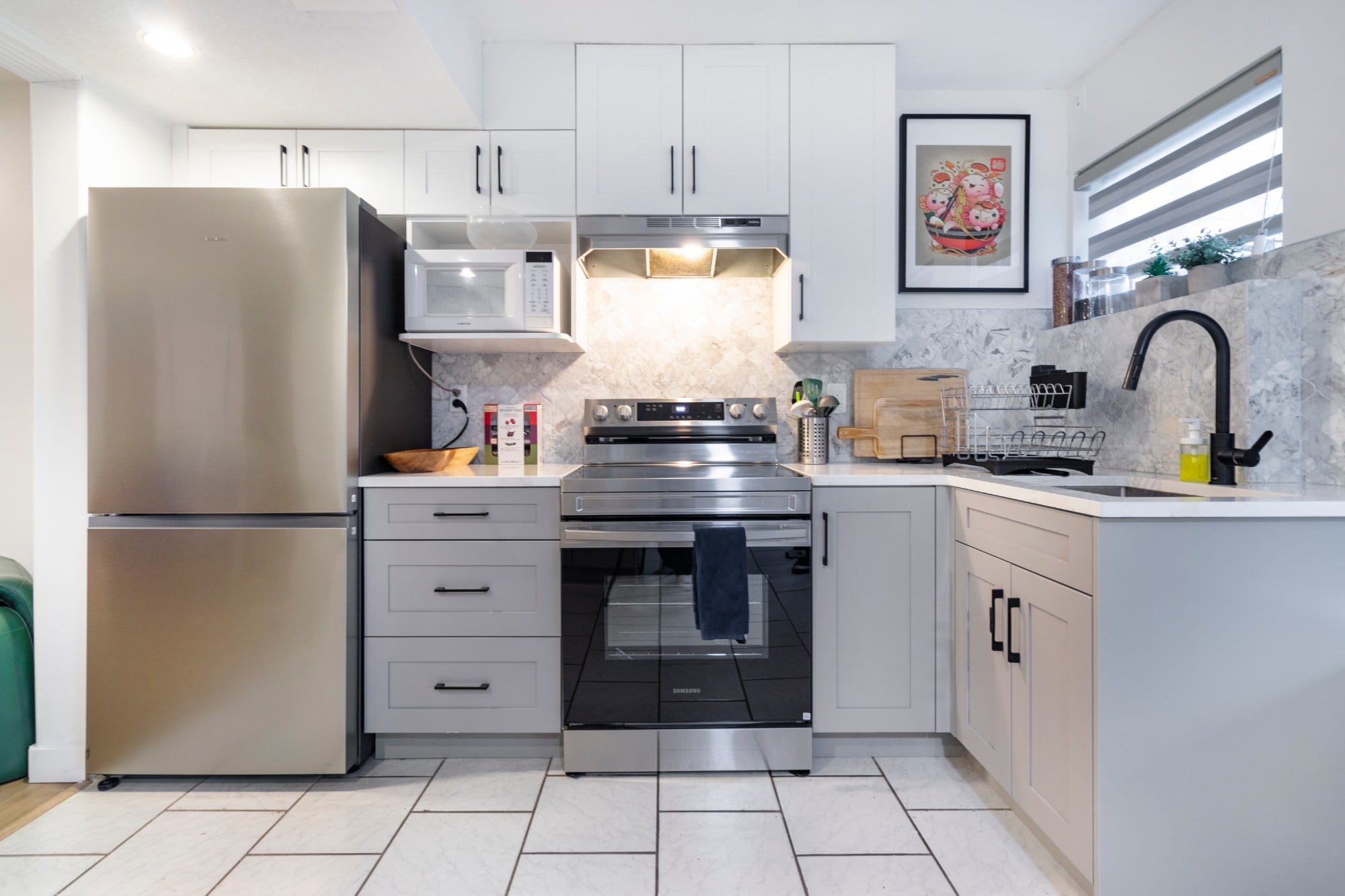 The suite's own kitchen: fridge, range and microwave